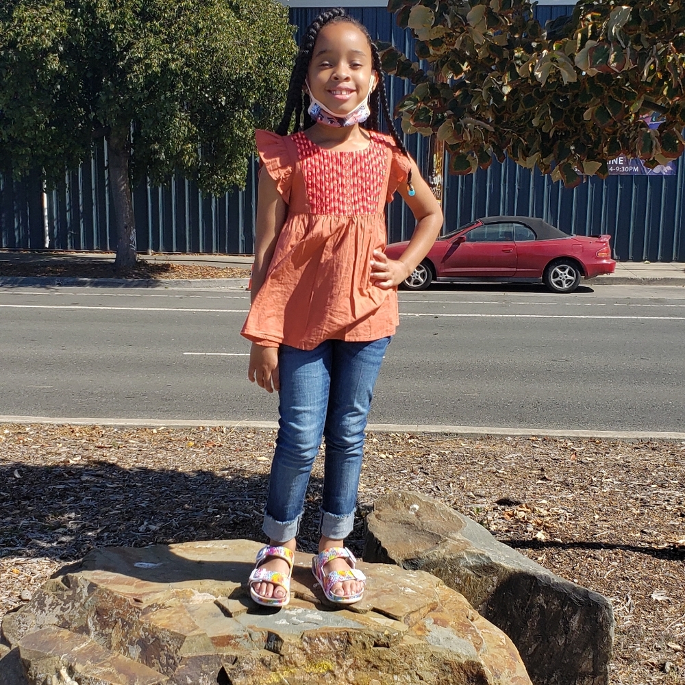 Girl's top and cropped jeans